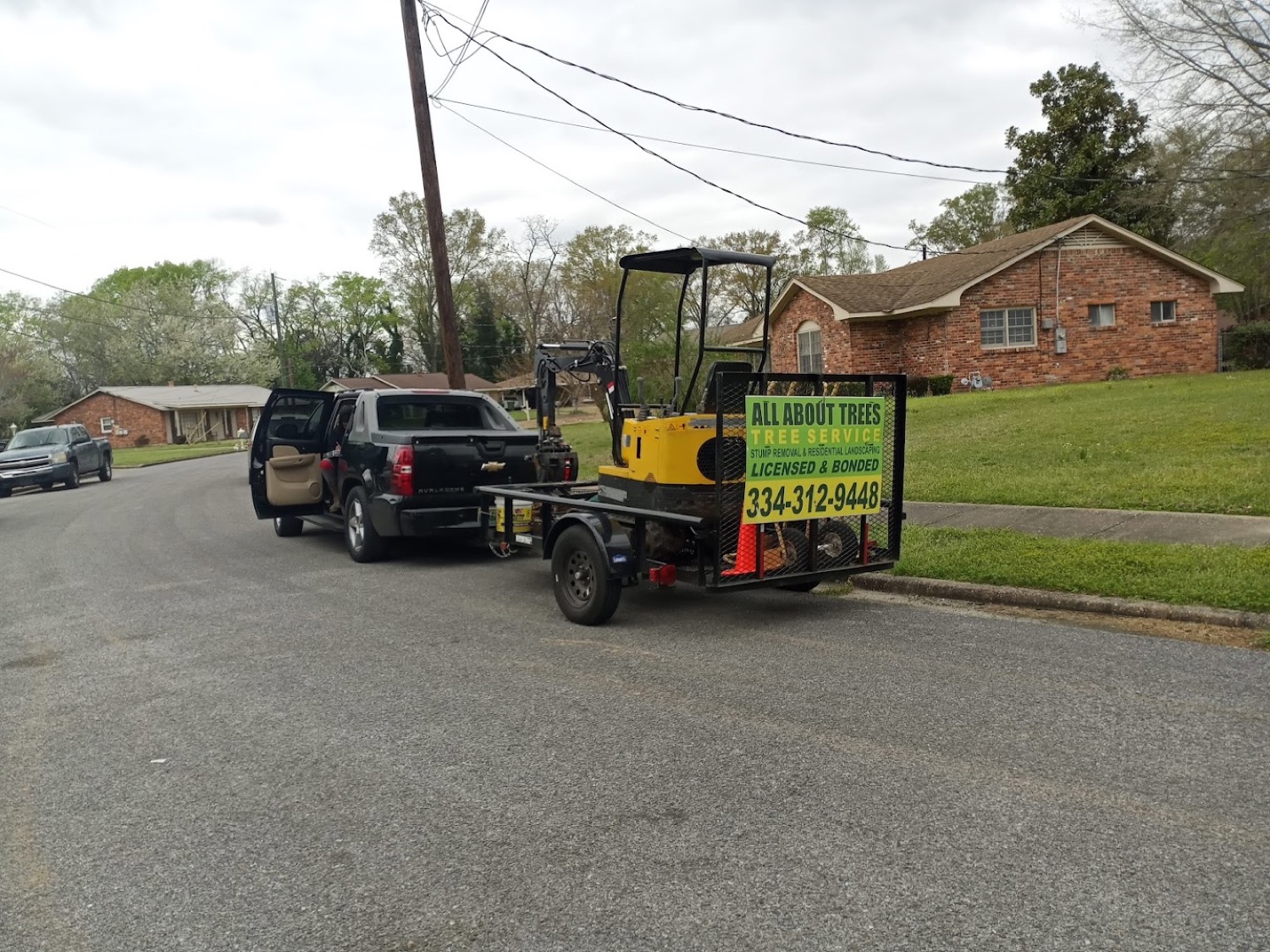 The All About Trees truck and tracked machine loaded up on a job